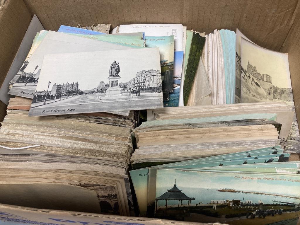 A collection of unused early 20th century postcards, largely Brighton views